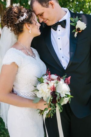 Hoopes Events | Chloe and Austin | Ben Lomond Suites | Ogden Utah | The Great Gatsby Wedding | Bride and Groom Touching Tenderly Chloe_Austin_Ben_Lomond_Suites_Ogden_Utah_Great_Gatsby_Bride_Groom_Tender_Touch.jpg