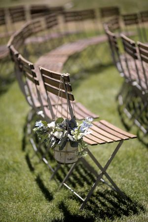 Wooden Chairs with Hanging Floral Arrangement Ceremony Details