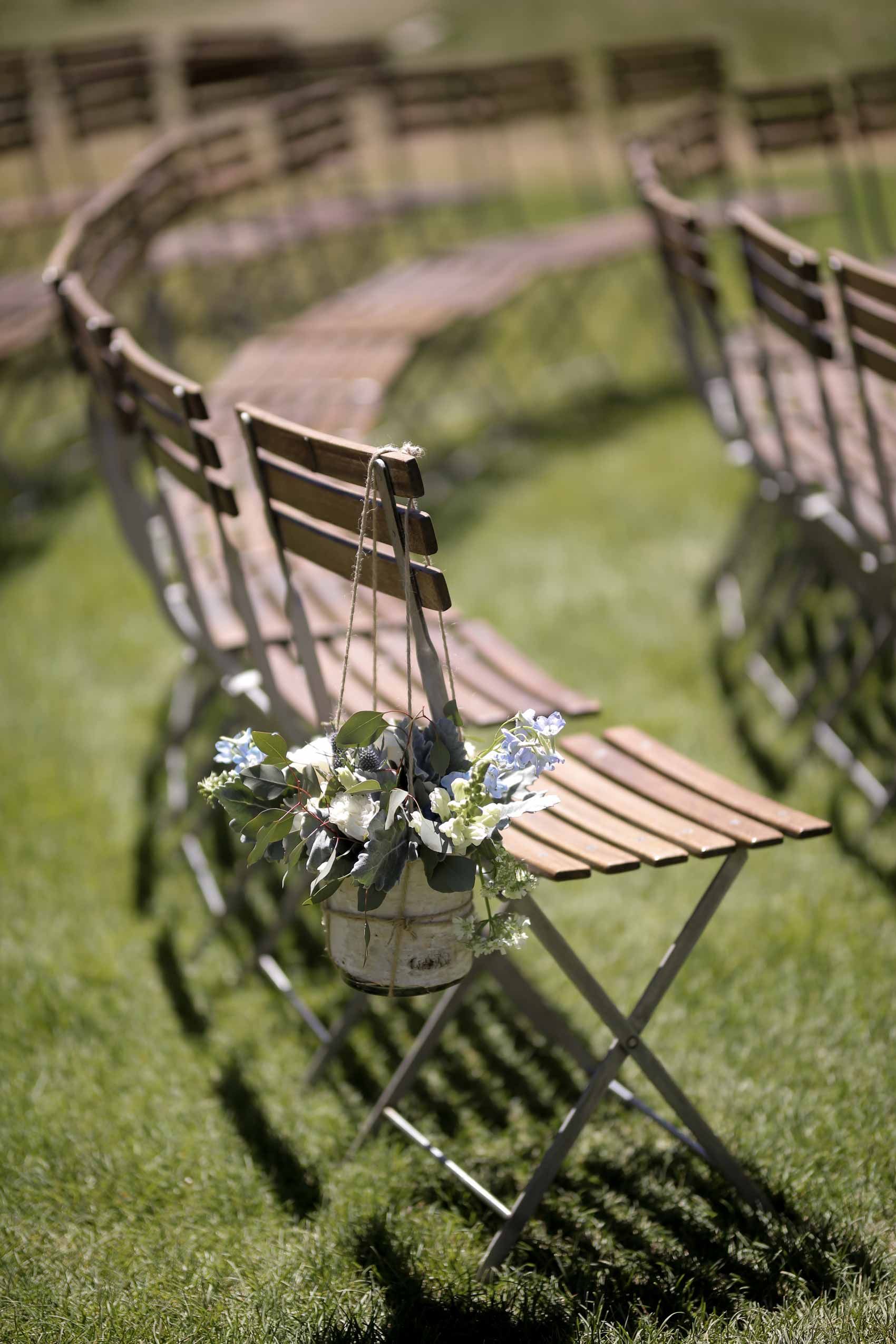 Wooden Chairs with Hanging Floral Arrangement Ceremony Details