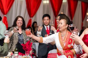 Guests and Couple Toast and Cheer During Dinner Reception