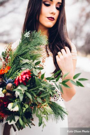 Hoopes Events | Romantic Winter-Styled Shoot | Bride Stretching Romantic_Winter_Shoot_Bride_Holding_Flower_Bouquet.jpg
