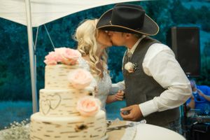 Hoopes Events | Kristin and Haven | Blacksmith Fork Canyon | Hyrum Utah | Couple Smooching After Cake Cutting Kristin_Haven_Blacksmith_Fork_Canyon_Hyrum_Utah_Smooch_After_Cake.jpg