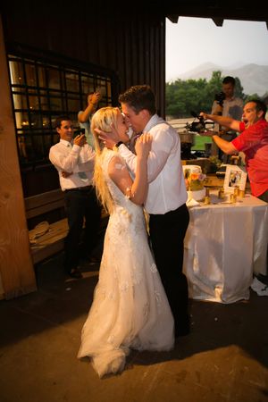 Hoopes Events | Tori and Sterling | Quiet Meadow Farms | Mapleton Utah | Bride and Groom Kiss After Cutting the Cake Tori_Sterling_Quiet_Meadow_Farms_Mapleton_Utah_Bride_Groom_Kiss_After_Cake_Cutting.jpg