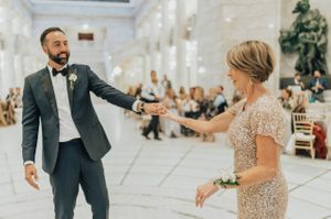 Groom dances with mother during reception Reception