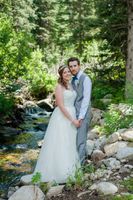 Ashley_Dan_Solitude_Resort_Solitude_Utah_Bride_Groom_Embracing_Beside_Mountain_Streem.jpg