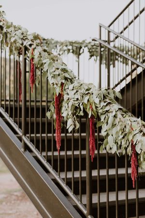 Red and Greenery Floral Decor on Bannister Decor