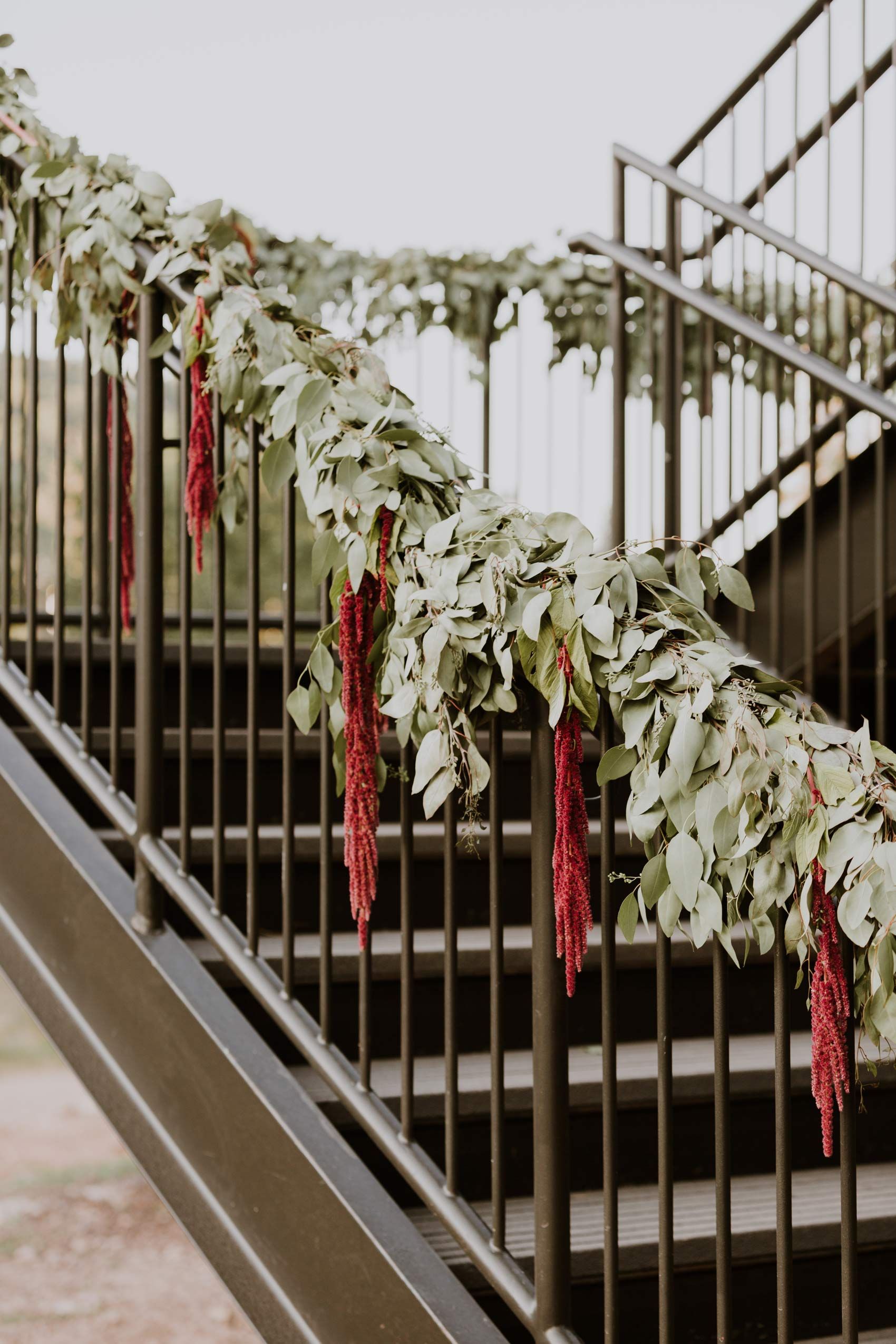 Red and Greenery Floral Decor on Bannister Decor