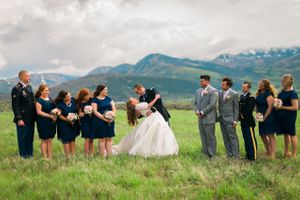 Hoopes Events | Katelyn and David | Park City Utah | Bride and Groom Kissing While Bridesmaids and Groomsmen Look On Katelyn_David_Park_City_Utah_Bride_Groom_Kissing_Bridesmaids_Groomsmen.jpg
