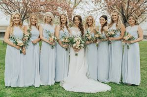 Bride with bridesmaids in light blue dresses After Ceremony