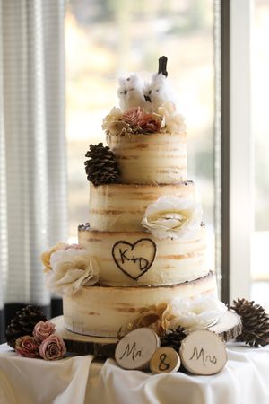 Hoopes Events | Tina and Dan | Snowbird Resort | Snowbird Utah | Wedding Cake Adorned with Mr. and Mrs. Wood Medallions Tina_Dan_Snowbird_Resort_Snowbird_Utah_Cake_Mr_Mrs.jpg
