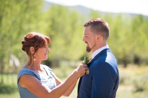 Hoopes Events | Chelsea and Walker | Red Cliff Ranch | Heber City Utah | Mother Putting Boutonniere on Groom Chelsea_Walker_Red_Cliff_Ranch_Heber_City_Utah_Groom_Mother_Boutonniere.jpg