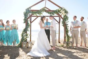 Hoopes Events | Aspyn and Steven | Bear Lake Utah | Bride and Groom Exchange Vows in Front of Wooden Arch Aspyn_Steven_Bear_Lake_Utah_Ceremony_Vows.jpg