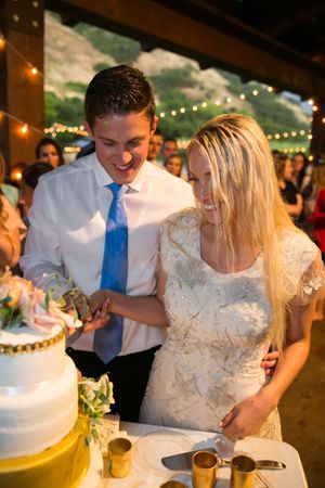 Hoopes Events | Tori and Sterling | Quiet Meadow Farms | Mapleton Utah | Bride and Groom Cutting the Wedding Cake Tori_Sterling_Quiet_Meadow_Farms_Mapleton_Utah_Bride_Groom_Cutting_Cake.jpg