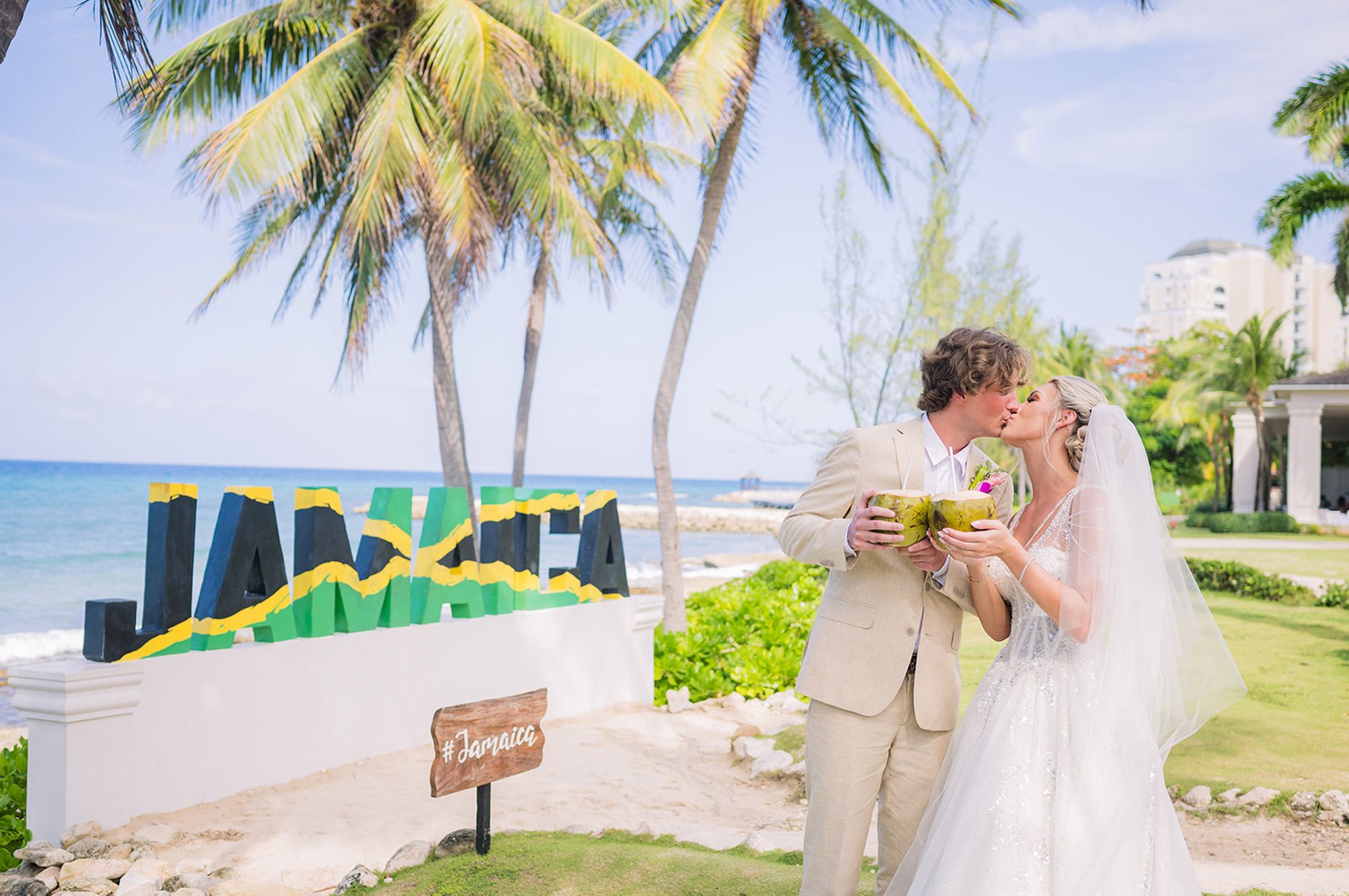 Couple Kissing by Jamaica Sign