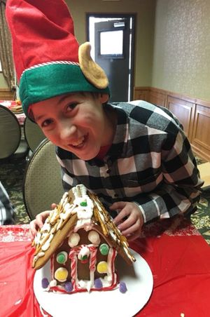 Hoopes Events | Zermatt Swiss Christmas | 2017 | Zermatt Utah Resort | Midway Utah | Young Elf With Gingerbread House Zermatt_Swiss_Christmas_2017_Zermatt_Utah_Resort_Midway_Utah_Young_Elf_Gingerbread_House.jpg