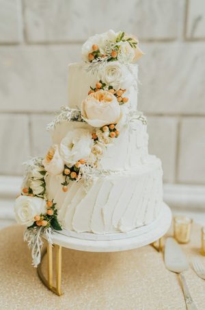 White cake with peach peonies and white roses Reception - Details