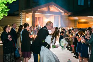 Hoopes Events | Katelyn and David | Park City Utah | Couple's Last Kiss During Sendoff Adorned by Glowing Candles Katelyn_David_Park_City_Utah_Glowing_Candle_Sendoff_Last_Kiss.jpg