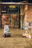 Modern_Industrial_Wedding_Shoot_The_Historic_Startup_Building_Provo_Utah_Comfortable_Chair_Candles.jpg