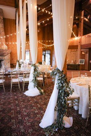 Draped Pillars with Floral Greenery Ties Details