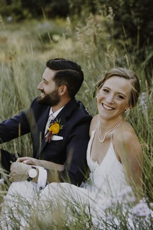 Bride and Groom Relaxing in Field First Look