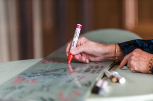 Ilana_Dave_Stein_Eriksen_Lodge_Deer_Valley_Park_City_Utah_Reception_Signing_Groom's_Snowboard.jpg