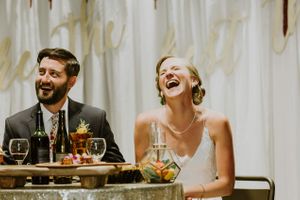 Laughing Bride at Eclectically Decorated Table Reception