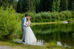 Ashley_Dan_Solitude_Resort_Solitude_Utah_Bride_Groom_Kissing_By_Mountain_Lake.jpg