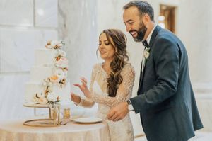 Bride and groom cutting the cake Reception