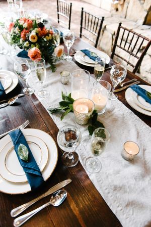 Hoopes Events | Rocky Mountain Bride | Winter Elopement | Deer Valley | Empire Lodge | Park City Utah | Wooden Table Set With Silver-Rimmed Dishes Accented by a Floral Centerpiece Rocky_Mountain_Bride_Winter_Elopement_Deer_Valley_Empire_Lodge_Wooden_Table_Set_With_Silver_Rimmed_Dishes.jpg