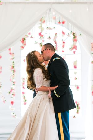 Hoopes Events | Katelyn and David | Park City Utah | Couple Kissing Before Carnation and White-Draped Backdrop Katelyn_David_Park_City_Utah_Couple_Kissing_Carnation_Backdrop.jpg