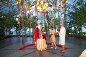 Colorful Ceremony with Vibrant Reds and Glowing Chandelier Ceremony