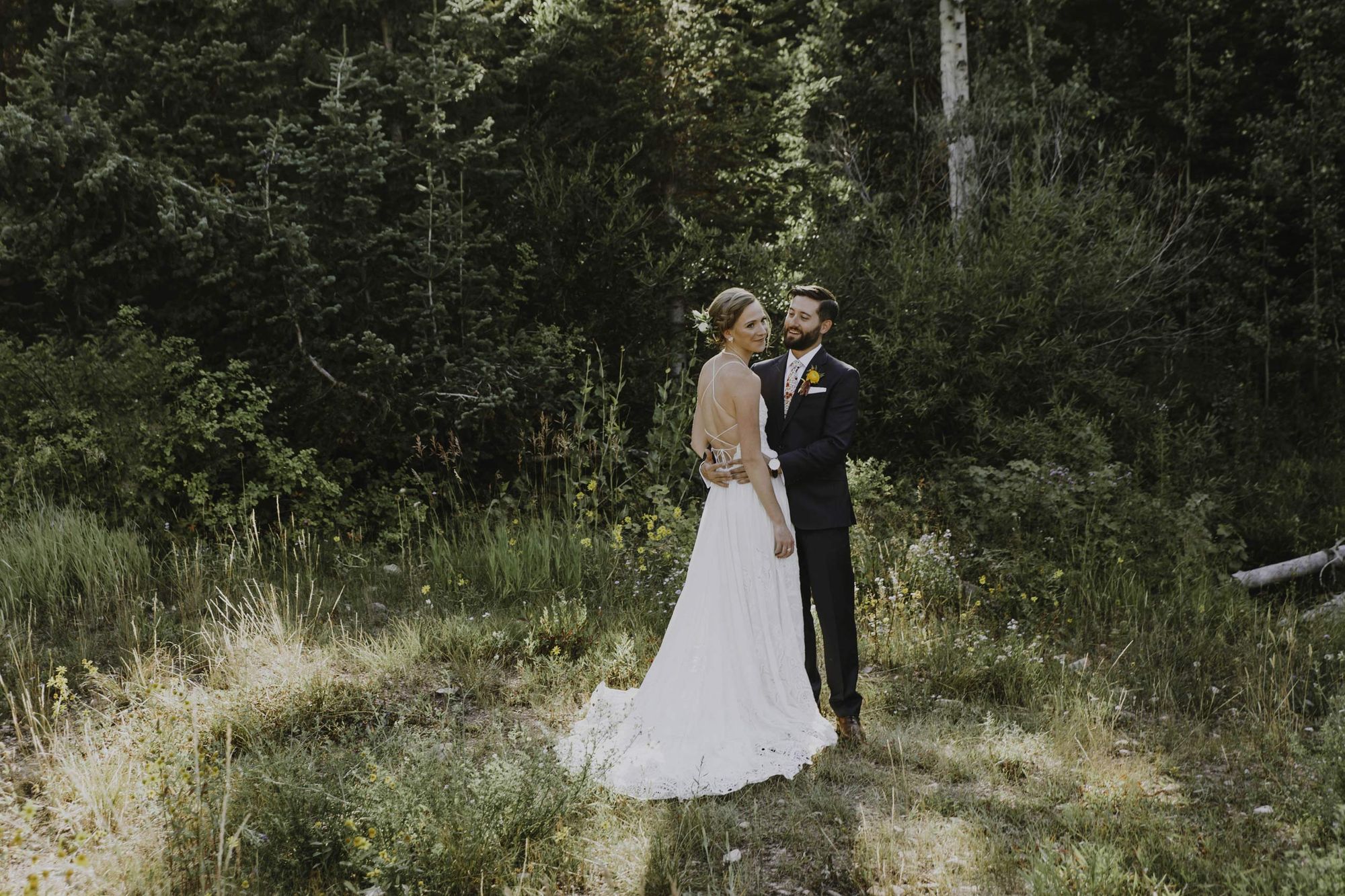 Happy Bride and Groom Posing in Field First Look
