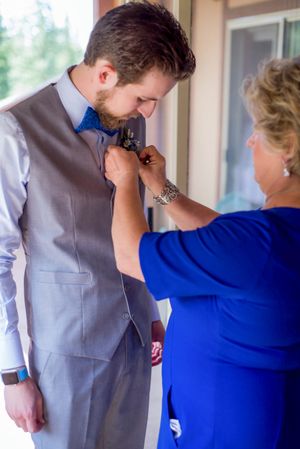 Hoopes Events | Ashley and Dan | Solitude Resort | Solitude Utah | Groom's Mother Pinning Boutonniere on Groom Ashley_Dan_Solitude_Resort_Solitude_Utah_Grooms_Mother_Putting_Boutonniere_on_Groom.jpg