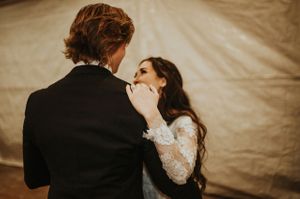 Bride and Groom Smile During First Dance Reception