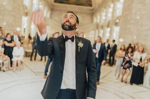 Groom tosses garter to men Reception - Garter Toss