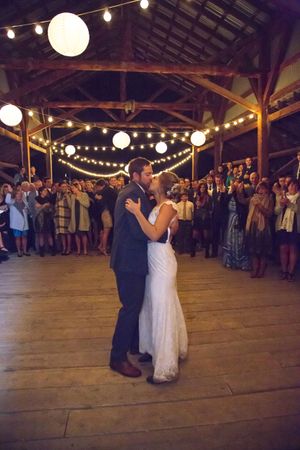 Hoopes Events | McCall and Brad | DeJoria Center | High Star Ranch | Kamas Utah | Bride and Groom Dancing in Barn Under Bistro Lights and Chinese Lanterns McCall_Brad_High_Star_Ranch_Kamas_Utah_Bride_Groom_Dancing_Barn.jpg