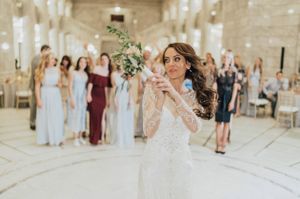 Bride tosses bouquet to waiting guests Reception - Bouquet Toss