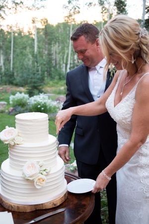 Hoopes Events | Evelyn and Kevin | Park City Utah | Bride and Groom Cutting the Wedding Cake Evelyn_Kevin_Park_City_Utah_Cutting_Cake.jpg