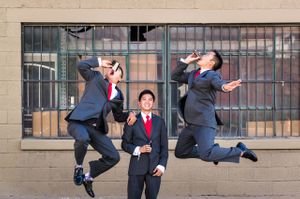 Groom and Groomsmen Celebrate With a Tip Of the Flask and a Leap In the Air Groom and Groomsmen