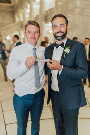 Groom with garter toss winner Reception