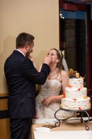 April_Matt_Park_City_Legacy_Lodge_Park_City_Utah_Feeding_Each_Other_Wedding_Cake.jpg
