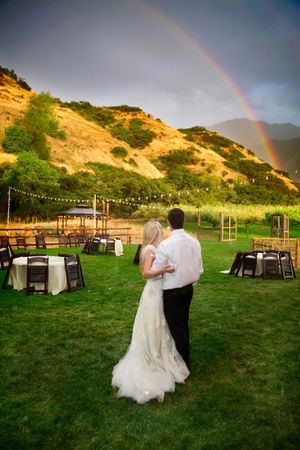 Hoopes Events | Tori and Sterling | Quiet Meadow Farms | Mapleton Utah | Bride and Groom Enjoy Colorful Rainbow After Downpour Tori_Sterling_Quiet_Meadow_Farms_Mapleton_Utah_Bride_Groom_Enjoying_Rainbow_After_Downpour.jpg