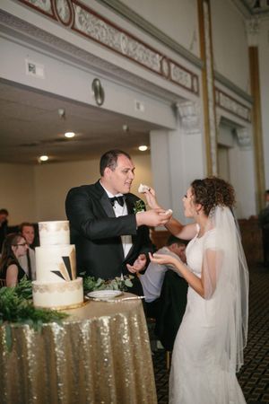 Hoopes Events | Chloe and Austin | Ben Lomond Suites | Ogden Utah | The Great Gatsby Wedding | Bride and Groom Feeding Each Other Cake Chloe_Austin_Ben_Lomond_Suites_Ogden_Utah_Great_Gatsby_Bride_Groom_Feeding_Each_Other_Cake.jpg