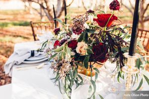 Red and Black Centerpiece on Elegantly-Set Table Details