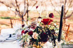 Vivid Red and Black Centerpiece on Table Details