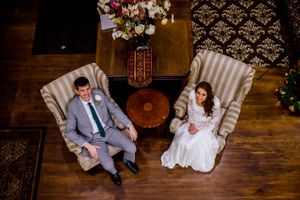 Hoopes Events | Shauna and Blake | Northampton House | American Fork Utah | Smiling Couple Seated in Comfortable Armchairs Shauna_Blake_Northampton_House_American_Fork_Utah_Couple_Seated_Armchairs.jpg