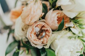 Wedding rings on flower arrangement Reception Details