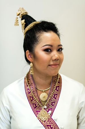 Bride In Traditional Wedding Attire and Jewelry Pre-Ceremony