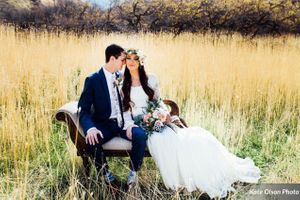 Hoopes Events | Charming Barn Wedding | Quiet Meadow Farms | Mapleton Utah | Couple Seated on Swan Fainting Couch in Field Charming_Barn_Wedding_Quiet_Meadow_Farms_Mapleton_Utah_Couple_Seated_Swan_Fainting_Couch_Field.jpg