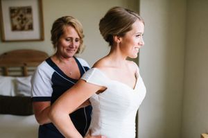 Helping Bride with Dress Getting Ready